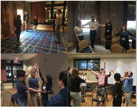 A group of people in a room Description automatically generated with low confidence